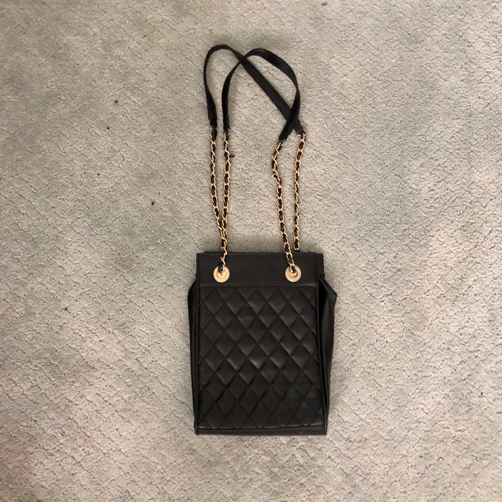 Black purse with gold chain straps